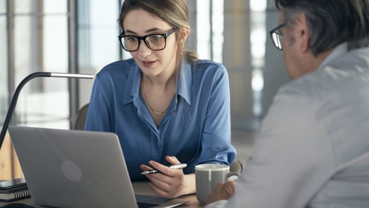 female attorney meets with client to discuss case