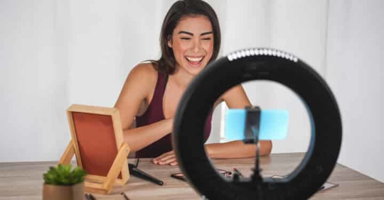 woman filming a makeup tutorial