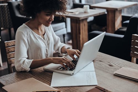 woman typing on laptop