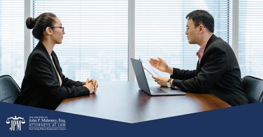 employee and manager talking in an office